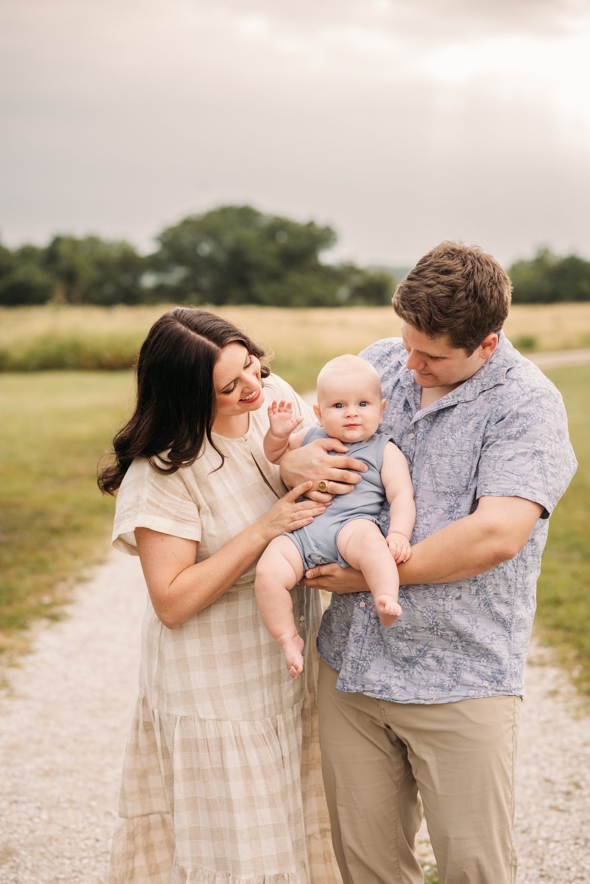Parents and children close together in warm evening sun — family photography in the Kansas City area