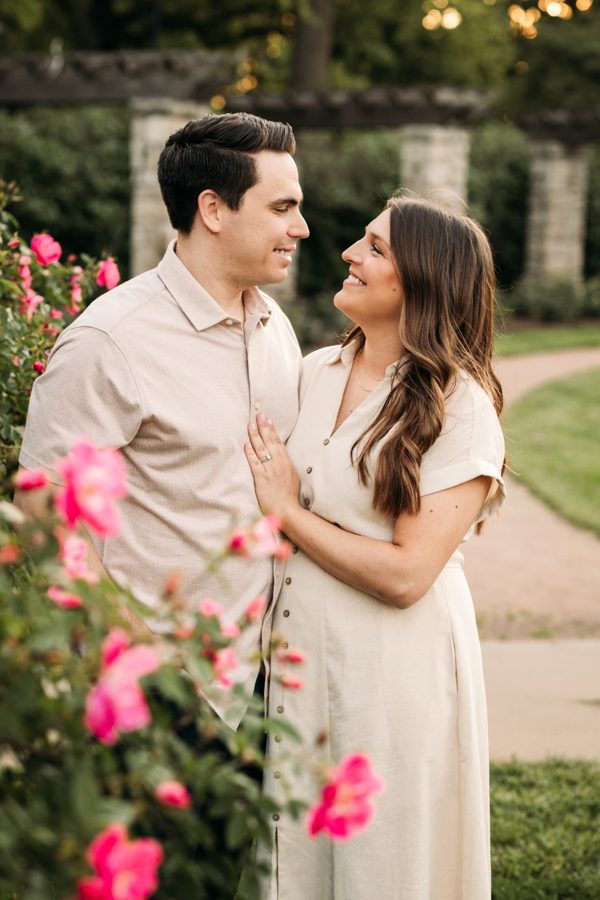 Couple sharing a quiet moment among the roses — family photography in the Kansas City area