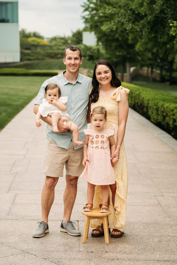 Family of four with their baby and toddler at the Kansas City Nelson-Atkins lawn — family photography in the Kansas City area